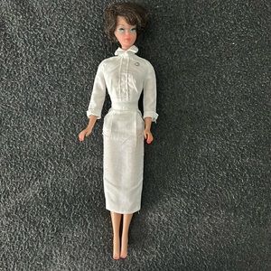 Barbie: 1960’s bubble cut hairstyle, nurse uniform.